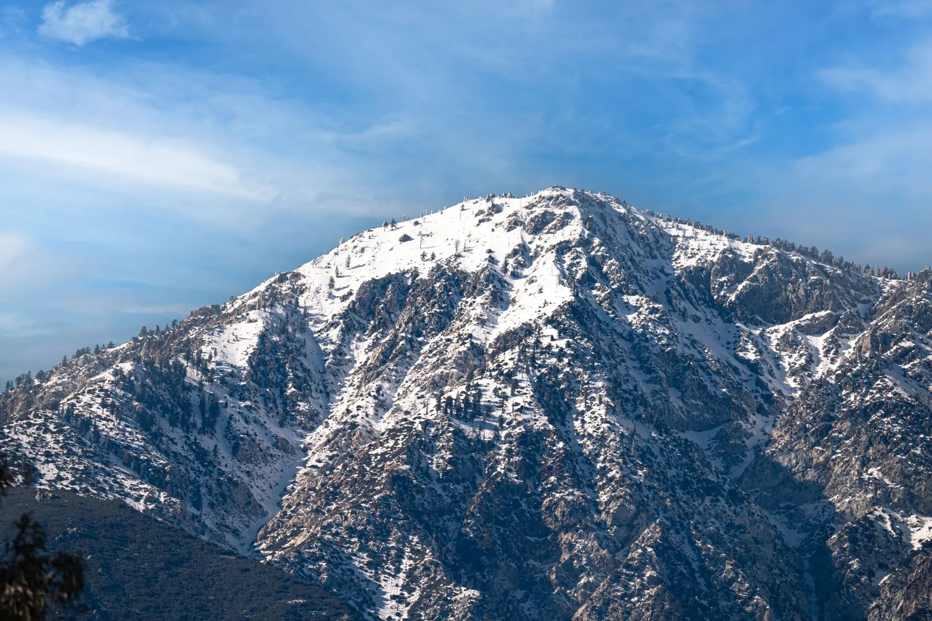 Snow on the San Gabriel Mountains under a clear sky
