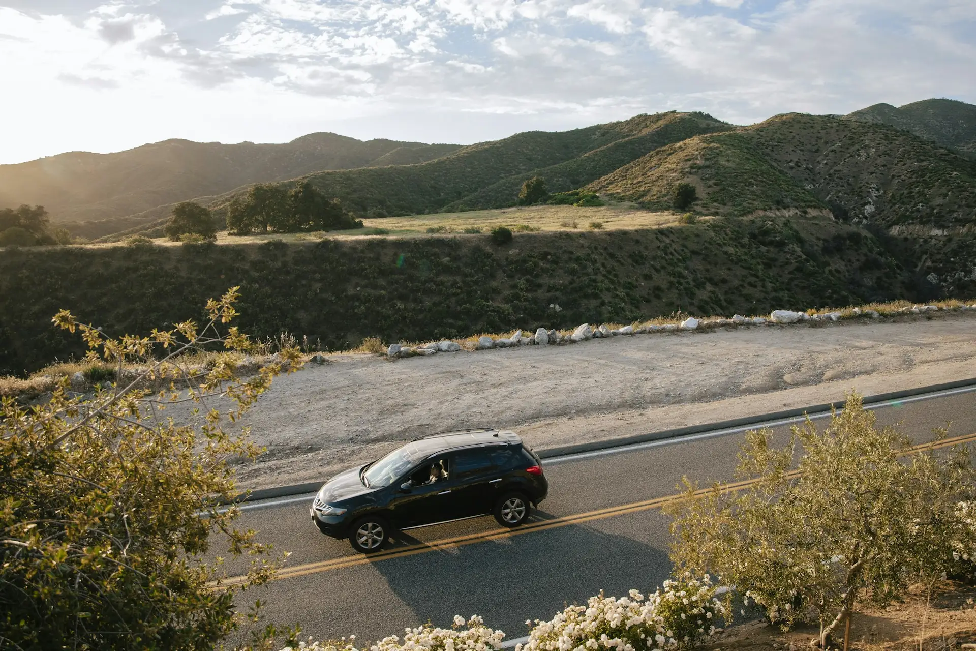 Small SUV on a Southern California foothill road