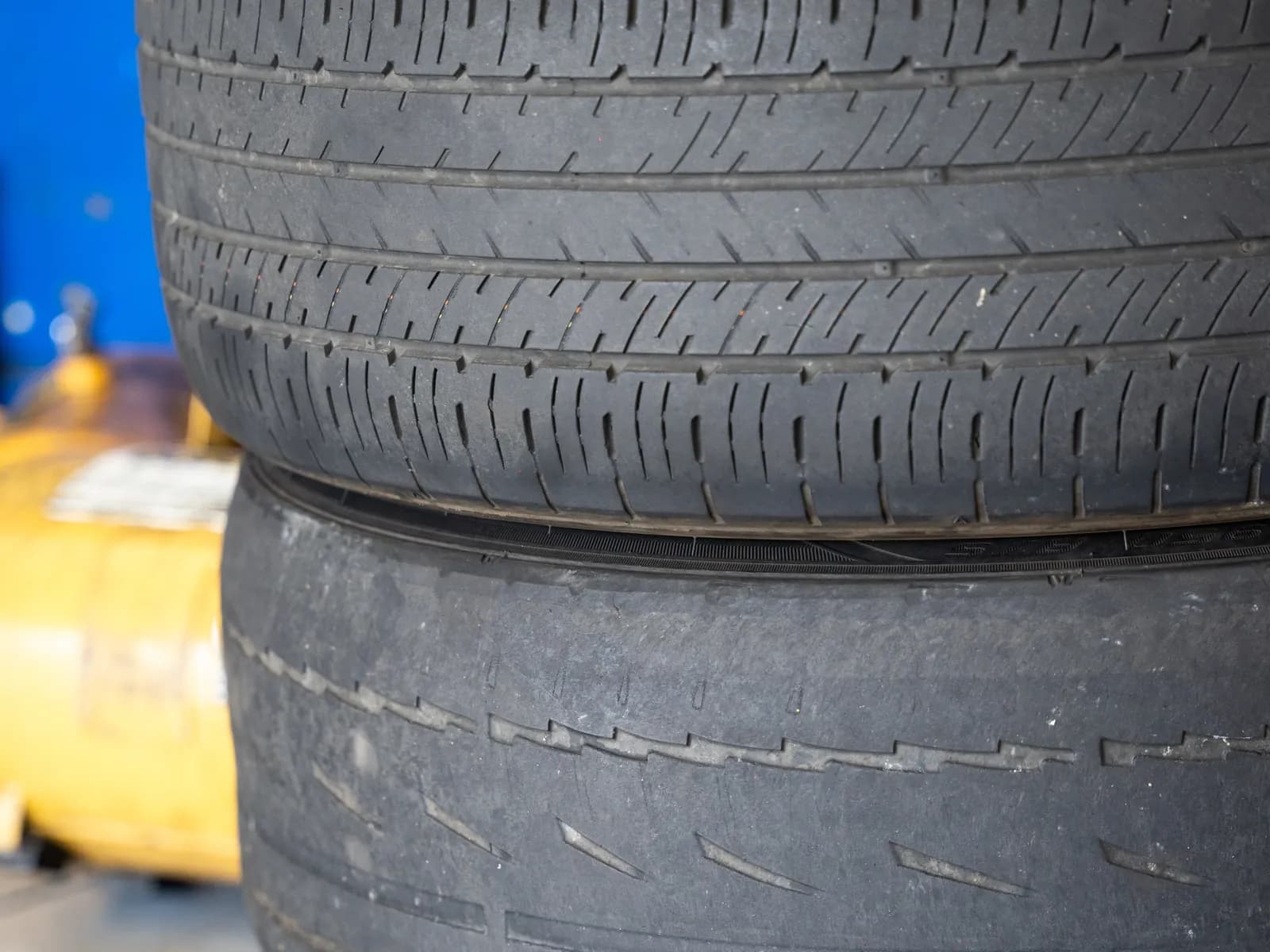 Close-up of tire tread on a stack of tires in the shop
