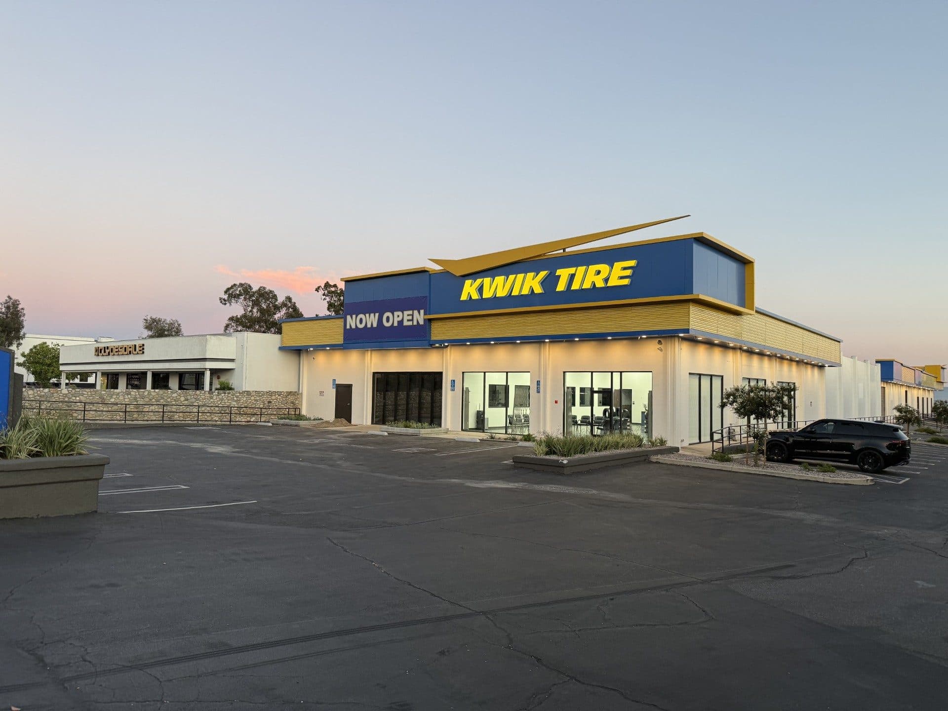 Kwik Tire storefront on Moreno Street in Montclair at dusk